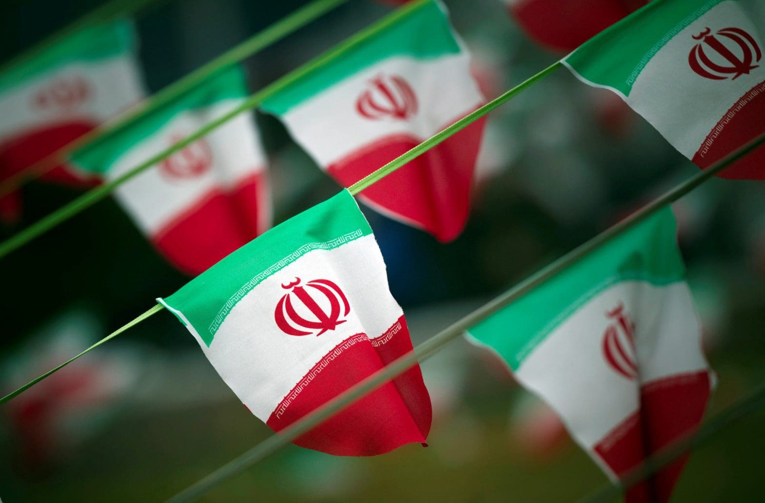 FILE PHOTO: Iran's national flags are seen on a square in Tehran February 10, 2012, a day before the anniversary of the Islamic Revolution. REUTERS/Morteza Nikoubazl/File Photo - RTX2RCC8