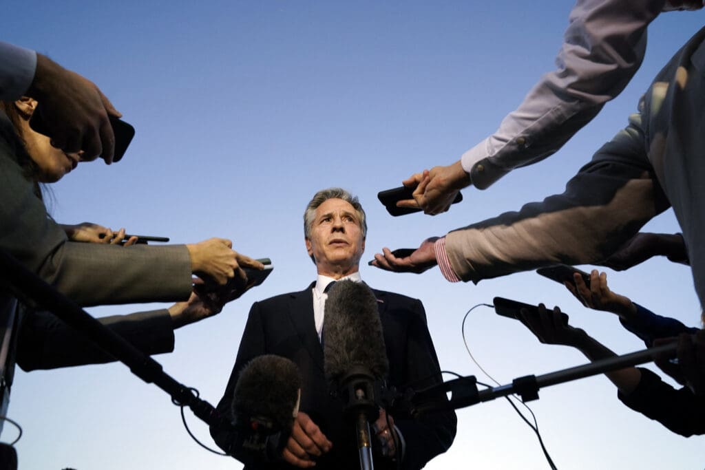 US Secretary of State Antony Blinken speaks to the media before boarding his plane in Cairo en route to Jordan on October 15, 2023. Blinken said October 15 there was a consensus among the United States' Arab allies to contain the Israel conflict with Hamas in the Gaza Strip. (Photo by Jacquelyn Martin / POOL / AFP) 